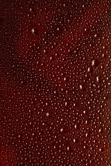 Image showing Close up view of cold drops on the glass of beer