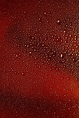 Image showing Close up view of cold drops on the glass of beer