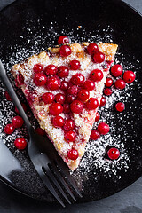 Image showing Homemade vegan red currant cake on black