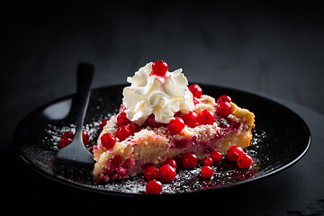 Image showing Homemade vegan red currant cake on black