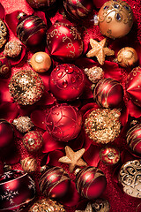 Image showing Christmas ornaments and baubles in red and golden tone 