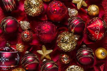 Image showing Christmas ornaments and baubles in red and golden tone 