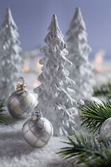 Image showing White trees with small Christmas balls as snowy landscape