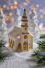 Image showing Small church with candles and white trees as snowy landscape