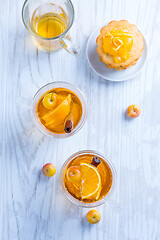 Image showing Apple cider cocktail with cinnamon and small lemon curd tarts