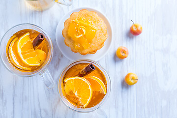 Image showing Apple cider cocktail with cinnamon and small lemon curd tarts