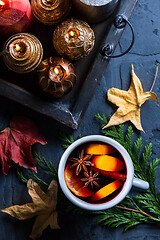 Image showing Spicy mulled wine with orange, cinnamon and anise in mug