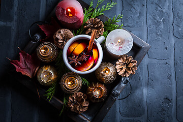 Image showing Spicy mulled wine with orange, cinnamon and anise in mug