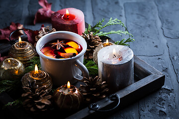 Image showing Spicy mulled wine with orange, cinnamon and anise in mug