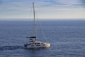 Image showing Small Sailing boat yacht in the open blue Sea