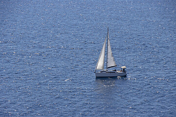 Image showing Small Sailing boat yacht in the open blue Sea