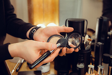 Image showing Professional makeup artist working at salon