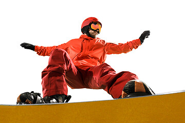 Image showing Portrait of young man in sportswear with snowboard isolated on a white background.