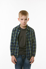 Image showing Portrait of an annoyed boy of ten years on a white background