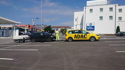 Image showing BAD RAPPENAU, GERMANY- JULY 21, 2020: The ADAC General German Automobile Club service man from yellow car helps motorists in trouble.