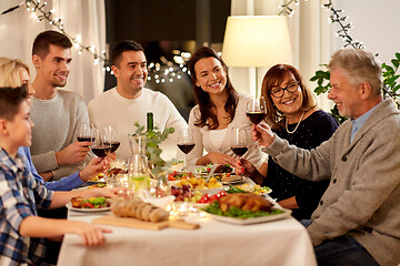 Image showing happy family having dinner party at home