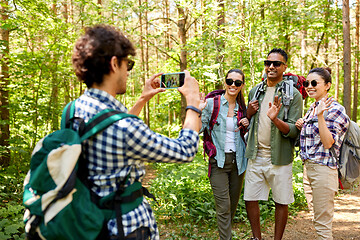 Image showing friends with backpacks being photographed on hike