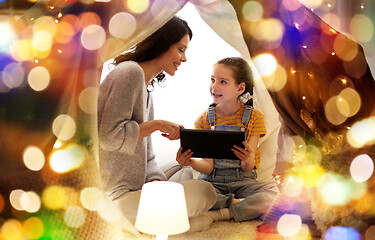 Image showing family with tablet pc in kids tent at home