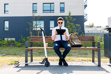 Image showing businessman with tablet computer, bag and scooter