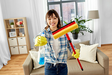 Image showing asian woman with window cleaner and sponge mop