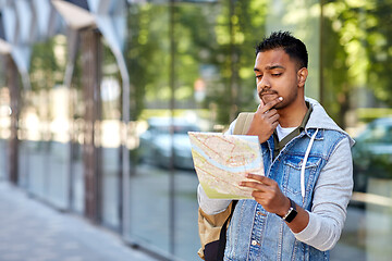 Image showing indian man traveling with backpack and map in city