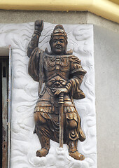 Image showing Warrior relief at the entrance of a Buddhist temple