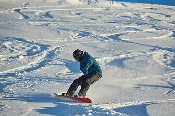 Image showing Snowboarding in fresh powder snow