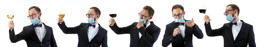 Image showing Portrait of male sommelier in suit isolated over white background