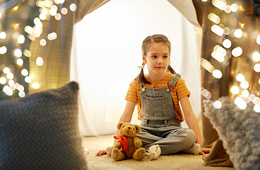 Image showing little girl with toys in kids tent at home