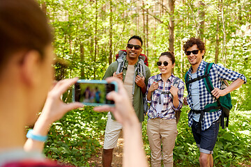 Image showing friends with backpacks being photographed on hike