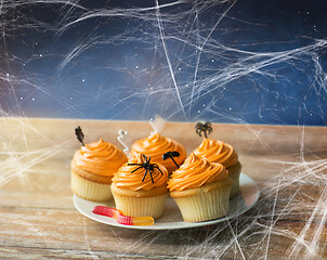 Image showing halloween party cupcakes and jelly candy on table