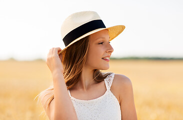 Image showing portrait of girl in straw hat on field in summer