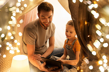 Image showing family with tablet pc in kids tent at home