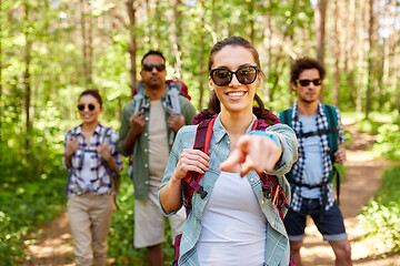 Image showing friends with backpacks on hike in forest