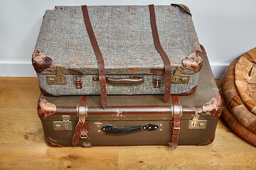 Image showing Vintage suitcases on the floor