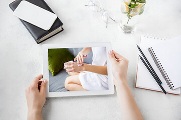 Image showing Tablet with promotion of spa salon, cosmetics, beauty and self-care. Copyspace for ad