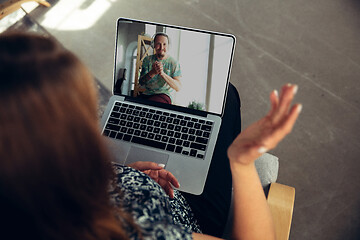 Image showing Woman watching online music concert at home during insulation, COVID-19 quarantine