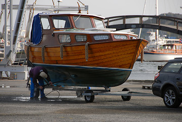 Image showing Working with high pressure on Wooden boat