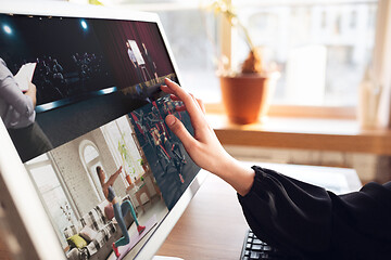 Image showing Woman choosing what to watch at home during insulation, COVID-19 quarantine