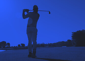 Image showing golf player hitting shot