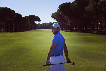 Image showing golf player portrait from back