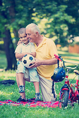 Image showing grandfather and child have fun  in park