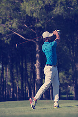 Image showing golf player hitting long shot