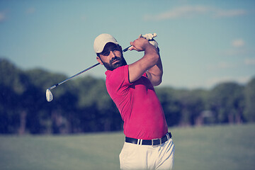 Image showing golfer hitting a sand bunker shot