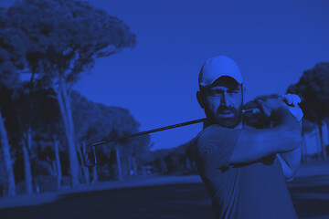 Image showing golf player hitting shot