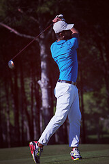 Image showing golf player hitting long shot