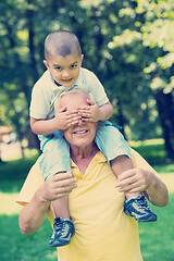 Image showing grandfather and child have fun  in park