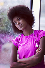 Image showing portrait of young afro american woman in gym while listening mus