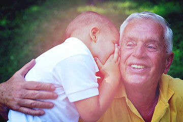 Image showing happy grandfather and child in park