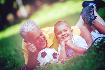 Image showing grandfather and child have fun  in park